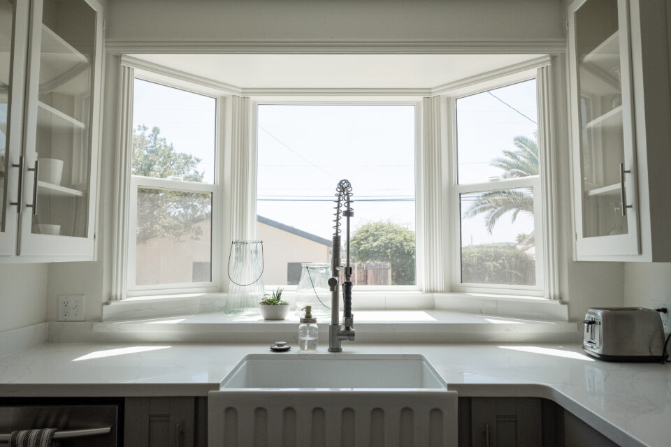 Bright kitchen with clean counters and a window